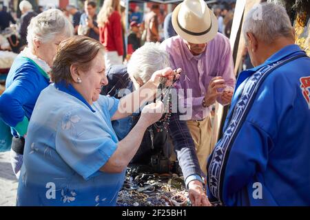 People looking at jewellery, Seville's oldest street market, Mercadillo de los Jueves, Thursday market, , Seville, Andalusia, Spain Stock Photo