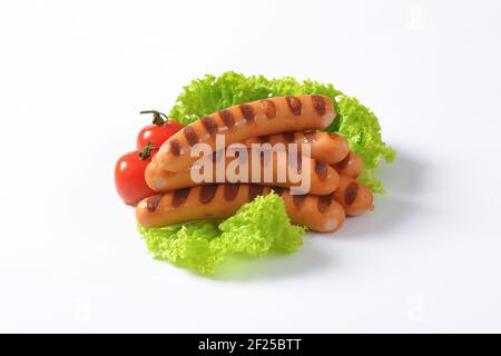 Grilled mini Vienna sausages  - studio shot Stock Photo
