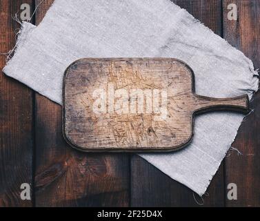 Background Image Rectangle Rounded Empty cutting board and gray linen napkin, gray textile background. Top ...