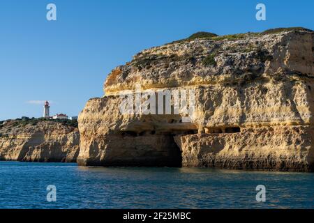 A view of the Alfanzina lighthouse on the beautiful Algarve coast of Portugal Stock Photo