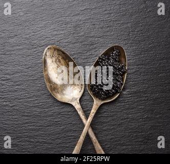 Black caviar of paddlefish fish in a spoon Stock Photo