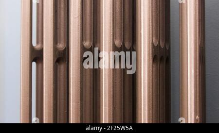 Close up section of cast iron radiator for use as background Stock Photo