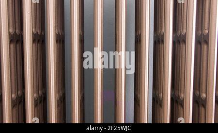 Full frame background of old fashioned metal cast iron radiator Stock Photo