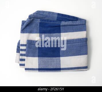 Folded white cotton fabric with blue stripes on white background Stock Photo
