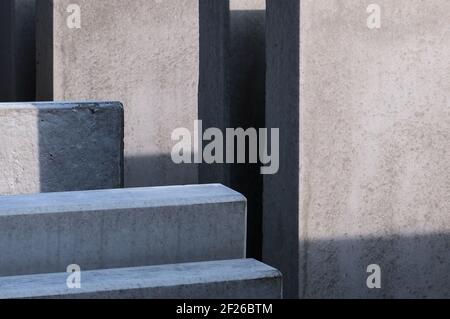 contrast of light and shadow on precast cement blocks at a construction site Stock Photo
