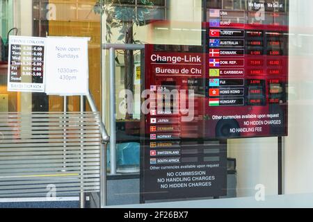 London, United Kingdom - February 02, 2019: Table with currency exchange rates on entrance window of Changelink foreign money change branch at Victori Stock Photo