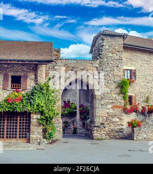 Facade with windows and flowers in Yvoire in France Stock Photo