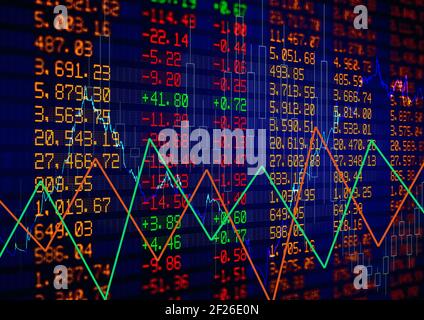 Green and red graphs over stock market data processing on blue background Stock Photo