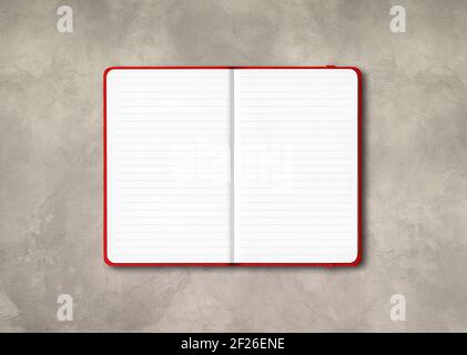 Red open lined notebook isolated on concrete background Stock Photo