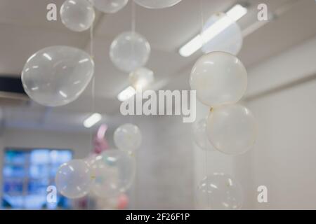 White And Transparent Balloons On Brick Wall Background Stock Photo