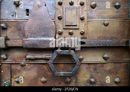 Old rusty door and sliding bolt in Citta Alta Bergamo Stock Photo