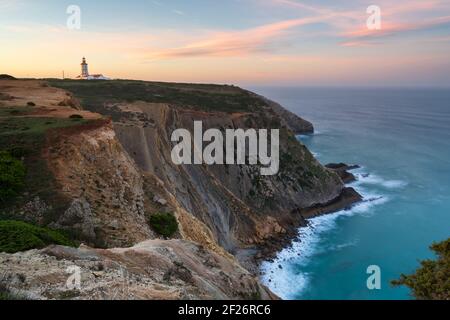 Cabo Espichel cape at sunset with sea cliffs and atlantic ocean landscape, in Portugal Stock Photo