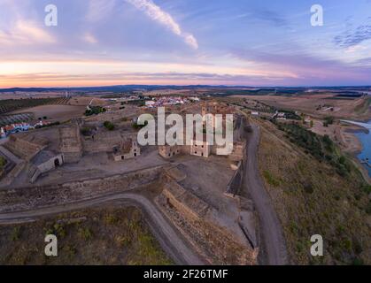 Juromenha castle, village and Guadiana river drone aerial view at sunset in Alentejo, Portugal Stock Photo