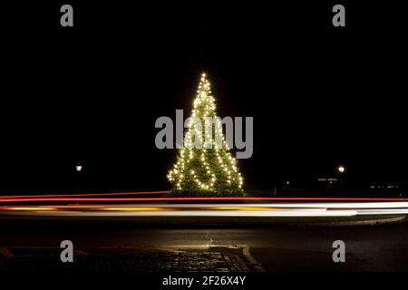 Christmas tree in the Park, Decorated with lights and light trails around, Xmas tree, merry, car light trails, glowing, roundabout, long exposure