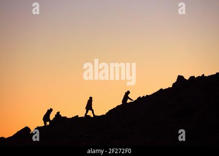 Hikers on Mt Olivier at dawn, Aoraki / Mount Cook National Park, South Island, New Zealand Stock Photo