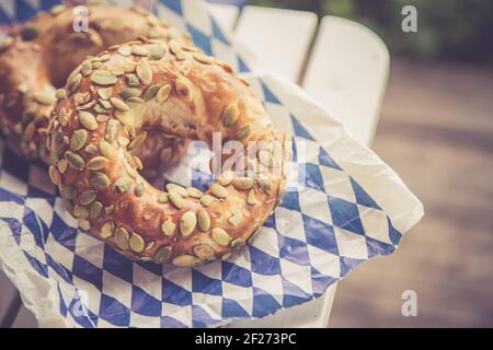 Bavarian bread for breakfast, blue white paper Stock Photo