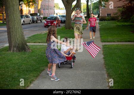 A family has a parade on the 4th of July Stock Photo