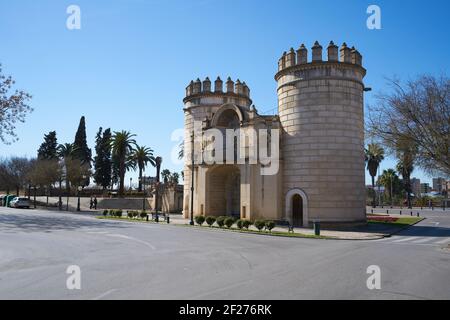 Puerta de Palmas entrance towers on a middle of a road in Badajoz, Spain Stock Photo