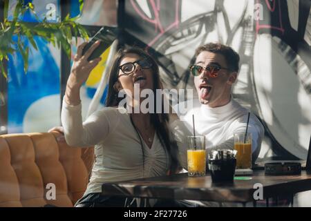 Co-workers spending time together on a break while working on a project on a lovely sunny day. Stock Photo