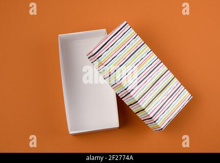 Open rectangular cardboard blank box on brown background Stock Photo