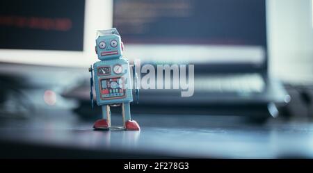Symbol for a chatbot or social bot and algorithms, program code in the background Stock Photo