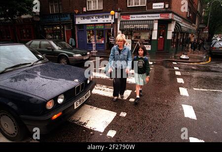 Walking home from The Cavendish school in Camden, Anna Silman (9) with Sonia Kaye who collects her and walks her home. Stock Photo