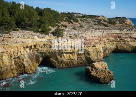 Wild beach nature landscape with turquoise water in Benagil Algarve, Portugal Stock Photo