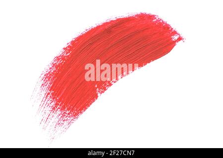 Red smudged lipstick stroke sample isolated on white background. Beauty face make up, close up. Makeup creamy texture. Beauty product smudge closeup Stock Photo
