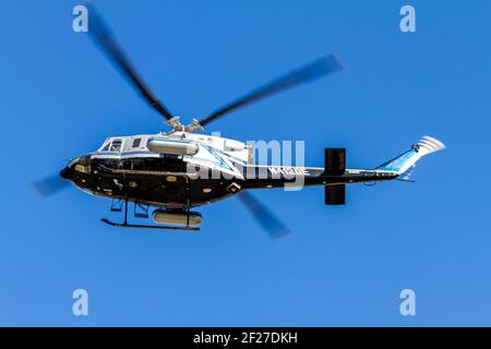Washington DC, USA 11-02-2020: A helicopter (Bell 412 Rotorcraft) belonging to US Department of Energy is flying in Washington DC. Sky. This is a clos Stock Photo