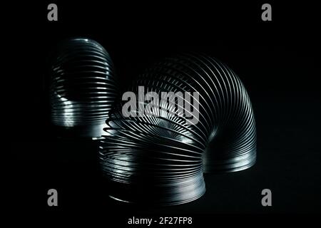 Abstract metal spirals with black background. Stock Photo