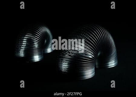 Abstract metal spirals with black background. Stock Photo