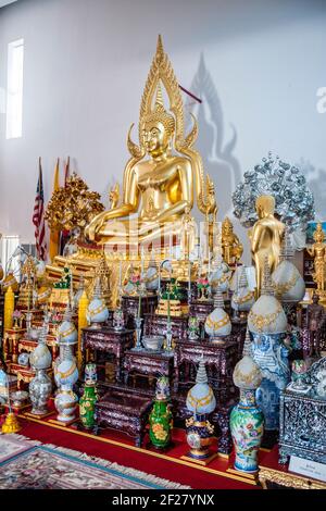 The altar area inside the Thai Buddhist Temple, Wat Buddharangsi of Miami, located in the rural Redland area of Miami-Dade County, Florida. Stock Photo