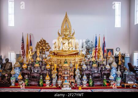 The altar area inside the Thai Buddhist Temple, Wat Buddharangsi of Miami, located in the rural Redland area of Miami-Dade County, Florida. Stock Photo