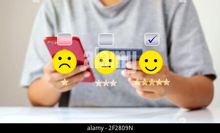 Online Shopping Evaluation and Decision Making Women are using their mobile phones to make purchases online. Stock Photo