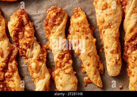Homemade cheese straws on a baking tray Stock Photo