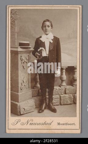 Portrait of an unknown boy dressed in a suit for the first holy communion .. Stock Photo