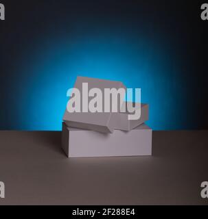 White gift boxes. Blank gift boxes and gift bags on blue background with shadow. Blank Mock up files Stock Photo