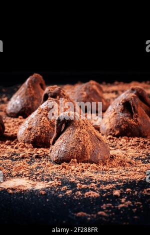 Many chocolate truffles on a black background Stock Photo