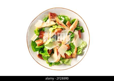 Caesar salad with grilled chicken, green lettuce and Parmesan Stock Photo