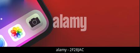 Kharkov, Ukraine - March 9, 2021: Camera app icon on Apple iPhone 12 screen close up, banner and copy space photo Stock Photo