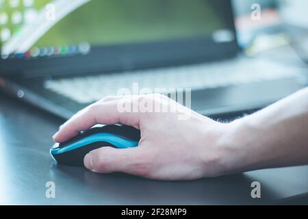 Computer input concept: Computer mouse and male hand Stock Photo