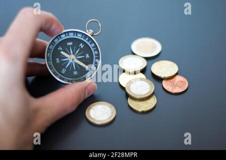 Innovation concept: Man is holding a compass in his hand, closeup cutout Stock Photo