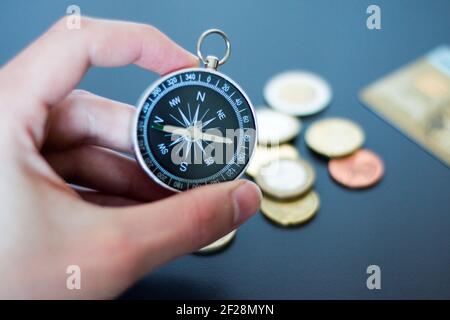 Innovation concept: Man is holding a compass in his hand, closeup cutout Stock Photo