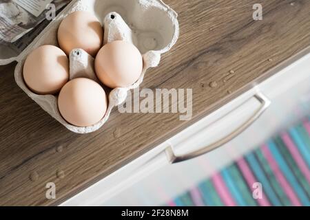 Fresh eggs in the morning: Cardbox of free range eggs in the kitchen Stock Photo