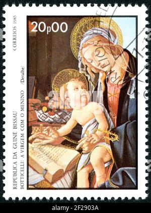 GUINEA-BISSAU - CIRCA 1985: A stamp printed in Guinea-Bissau, shown the painting by Botticelli (detail) - Virgin and Child, circa 1985 Stock Photo