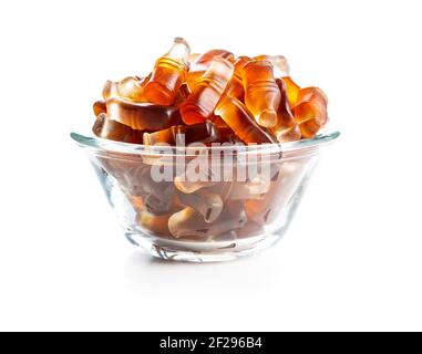 Jelly candies with cola flavor in bowl isolated on white background. Stock Photo