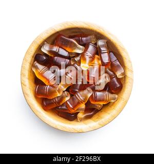 Jelly candies with cola flavor in bowl isolated on white background. Stock Photo