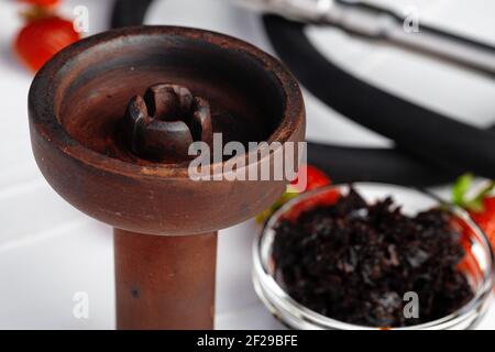 Empty hookah shaft close up on table with fresh fruit Stock Photo