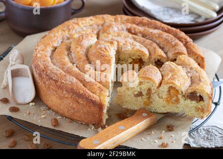 apricot raisin bun with sugar cinnamon crust Stock Photo