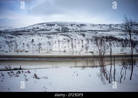 Landscape from the windows of the Arctic circle train from Bodo to Trondheim, Nordland, Norway.   At 729 kilometres, the Nordland Railway is Norway’s Stock Photo